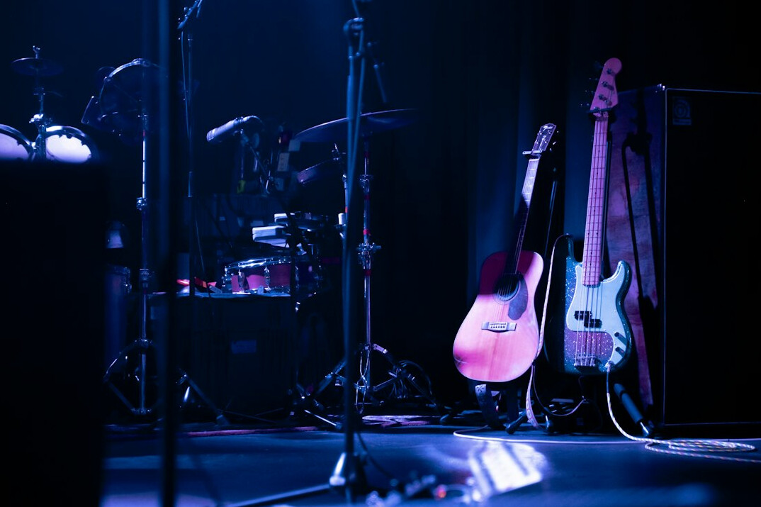 Concert stage with guitars, keyboard and stage lighting before a show