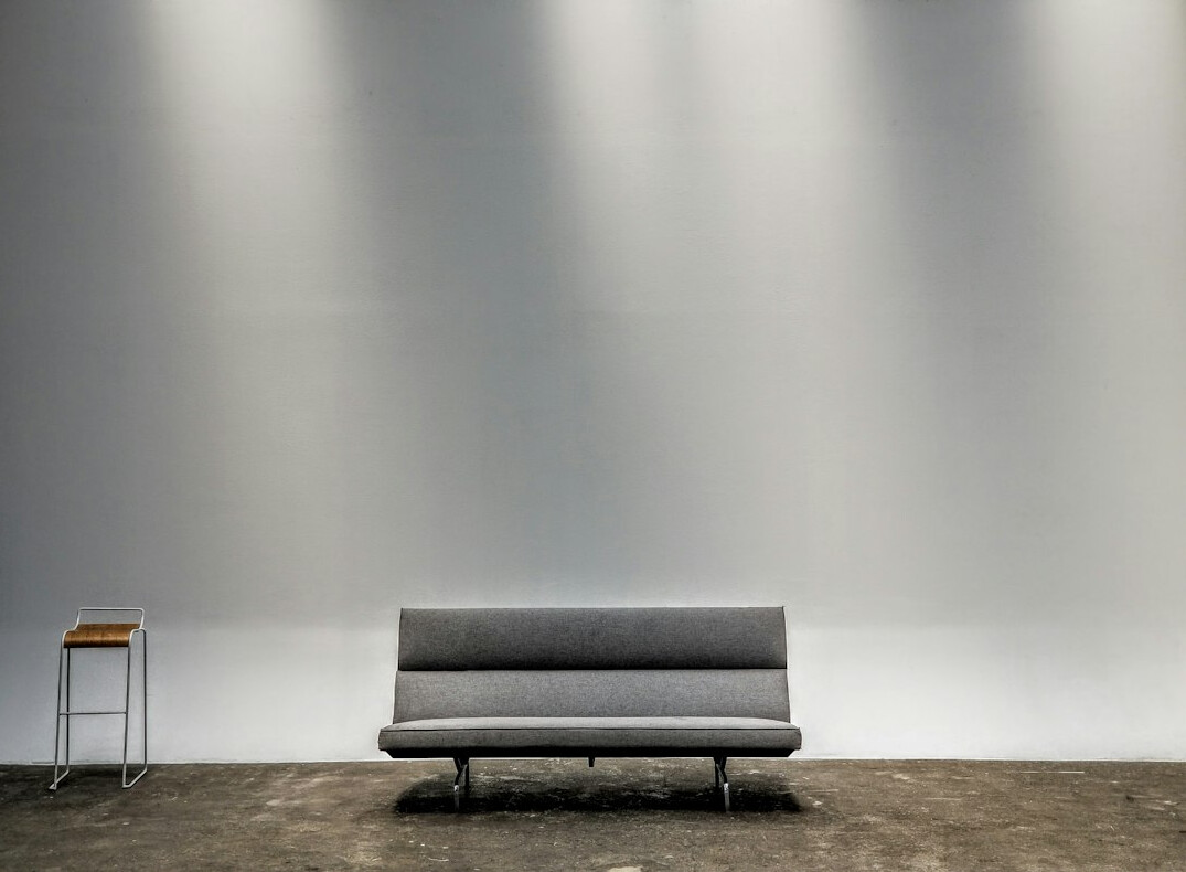 Empty television studio set with sofas and studio lights